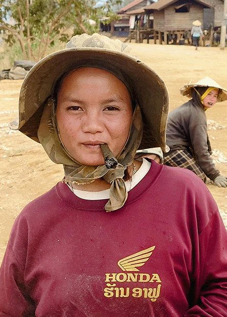 Woman smokes coffee leaves